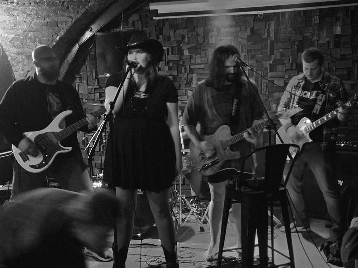 Black and white photograph of Diamond performing live